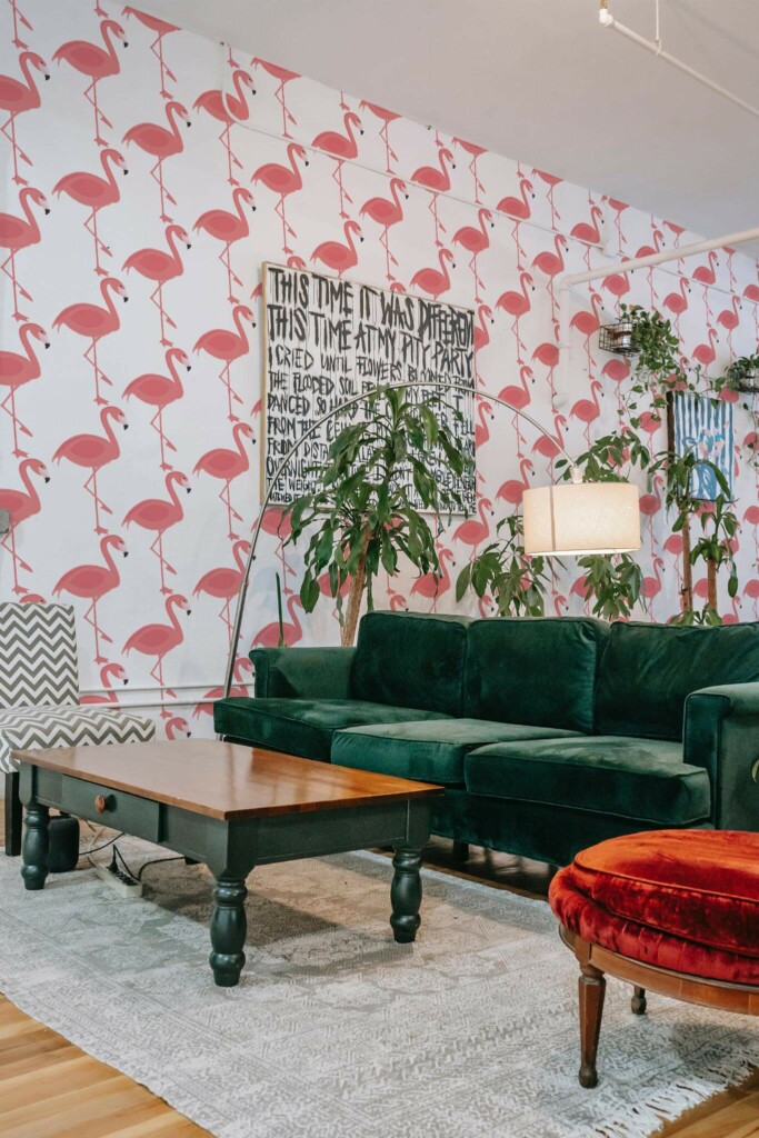 Bold eclectic style living room decorated with Pink flamingos peel and stick wallpaper and emerald green sofa