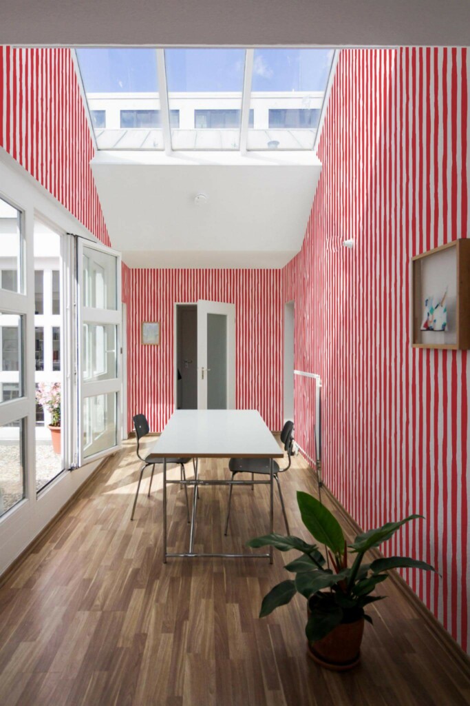 Minimal style dining room next to a balcony decorated with Red handdrawn stripes peel and stick wallpaper