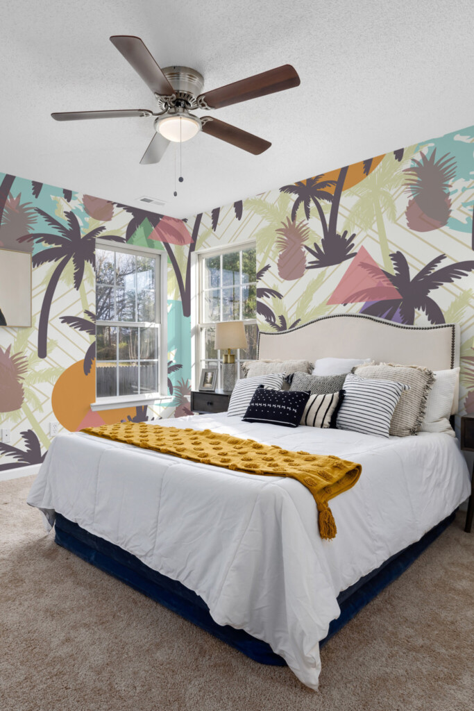 Wall paper mural showing overlapping palm silhouettes and pineapples on an abstract geometric background by Fancy Walls