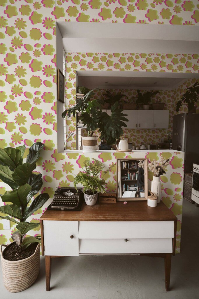 Boho style living room and kitchen decorated with Risograph effect peel and stick wallpaper and green plants