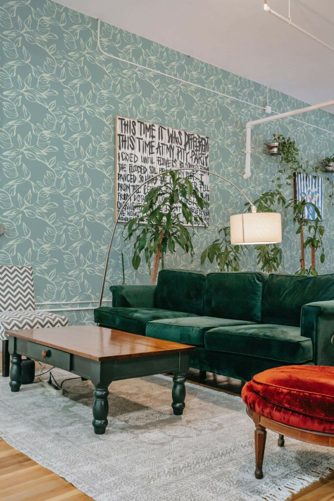 Bold eclectic style living room decorated with Sage leaves peel and stick wallpaper and emerald green sofa