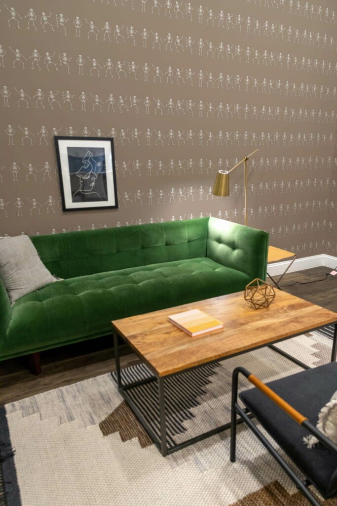 Mid-century modern living room decorated with Skeleton peel and stick wallpaper and forest green sofa