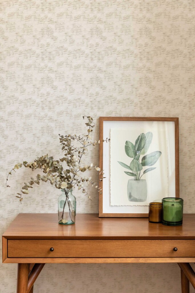 Interior scene with a wooden console table, framed botanical artwork, and spa-inspired accessories against a backdrop of beige and gray brushstroke wallpaper. This soft neutral pattern complements natural textures and works beautifully in entryways, spa lounges, or serene bedrooms.