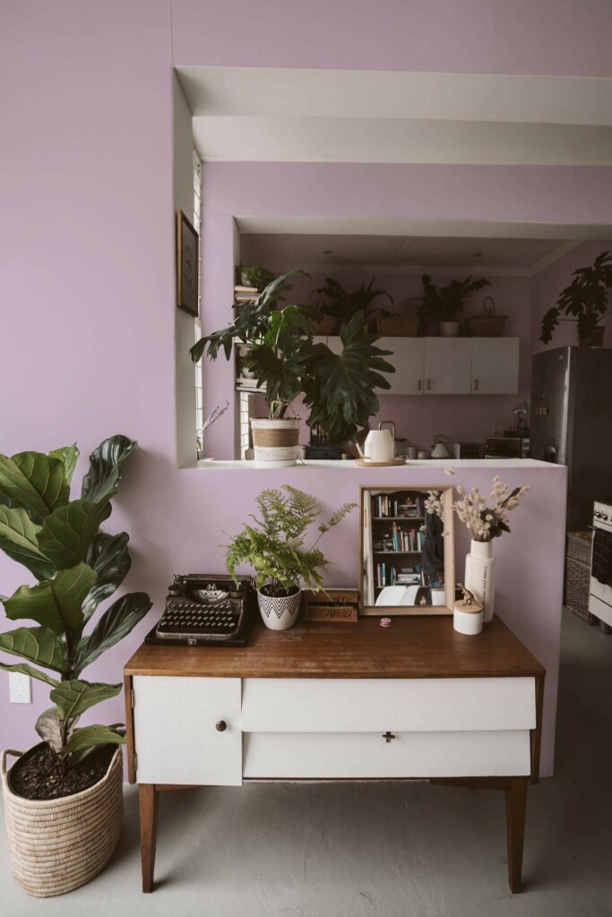 Boho style living room and kitchen decorated with Solid color pastel lilac peel and stick wallpaper and green plants