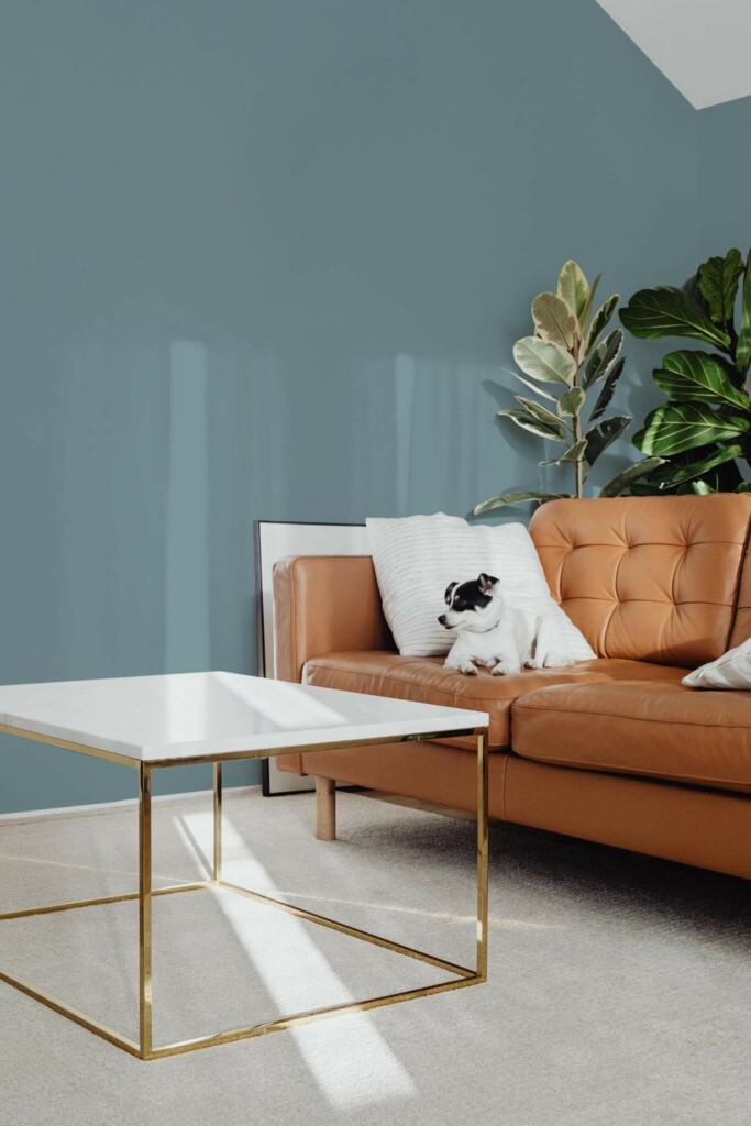 Mid-century modern style living room with dog on a sofa decorated with Solid powder blue peel and stick wallpaper