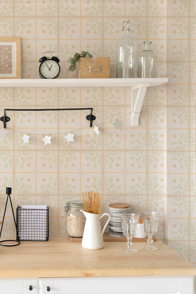 Cozy kitchen scene featuring Relaxing Spa Tiles wallpaper in a soft beige tile pattern with light brown, peach, and green floral accents. Open shelving and neutral decor create a warm, calming interior ideal for rustic, country-style, or wellness-inspired kitchens.