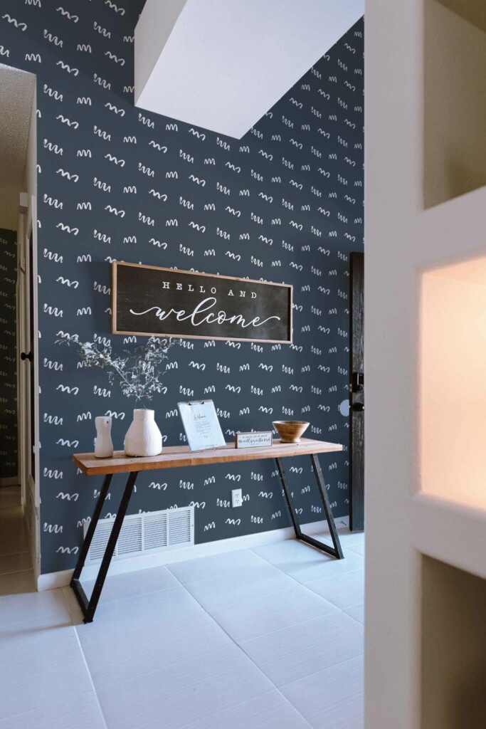 Minimal farmhouse style entryway decorated with Squiggly line peel and stick wallpaper