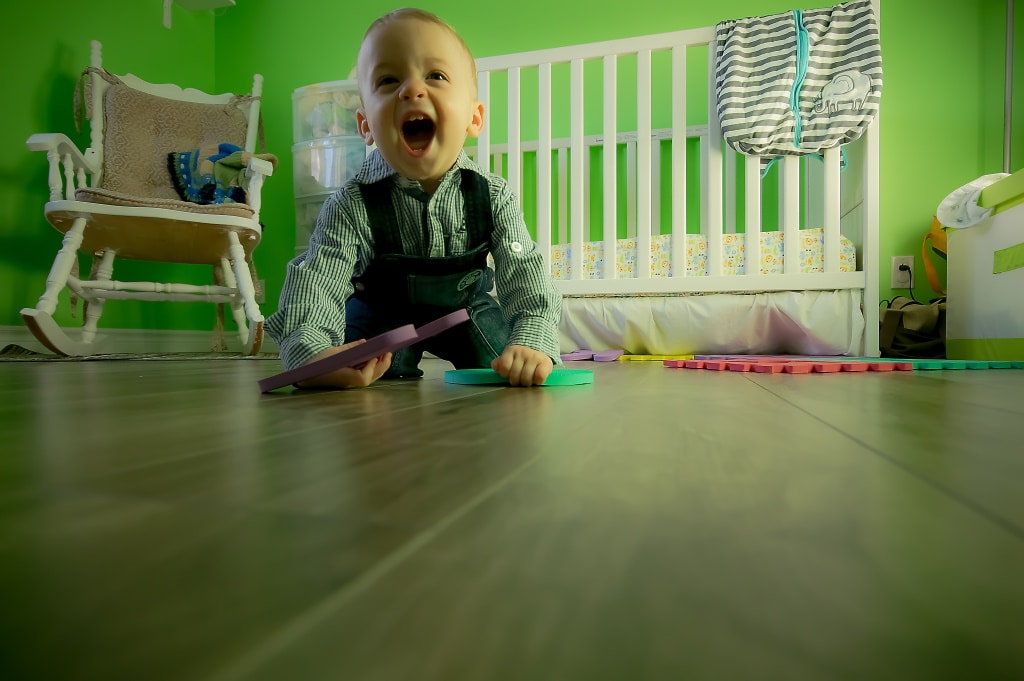 A boy playing in a toddler room