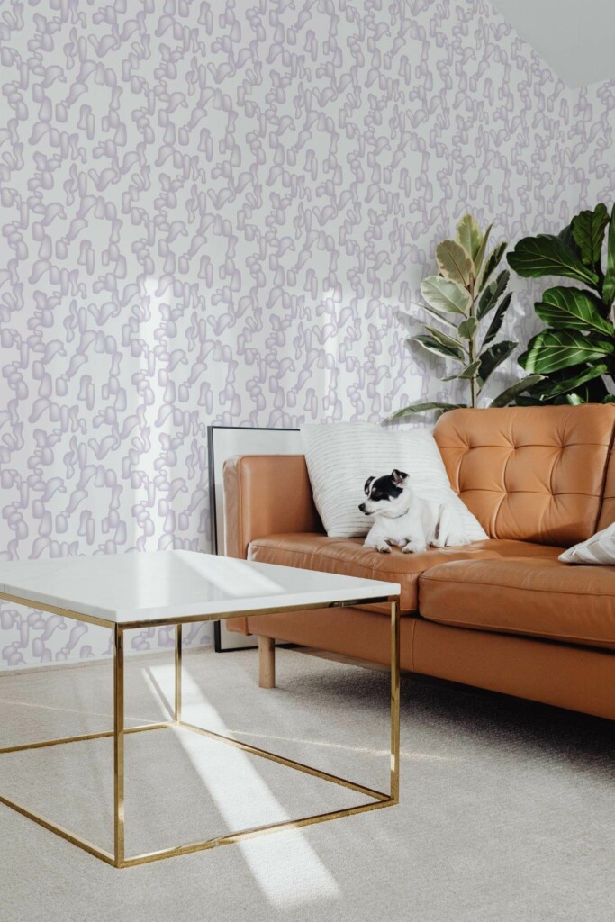 Mid-century modern style living room with dog on a sofa decorated with Violet abstract shapes peel and stick wallpaper
