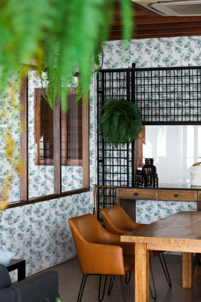 Mid-century modern style dining room decorated with Watercolor leaf peel and stick wallpaper and black industrial accents