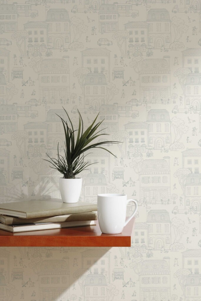 A cozy dining nook with beige fun wallpaper featuring a seamless city pattern of charming townhouses, trees, and human figures. Styled with neutral dishware and a small plant, the setting offers a warm and welcoming interior ideal for kitchens or breakfast corners. This neutral wallpaper design by Fancy Walls complements Scandinavian and minimalist décor aesthetics.