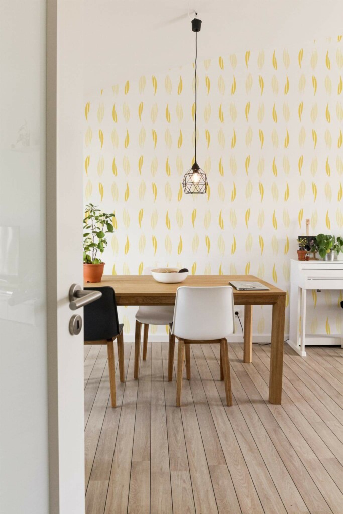 Minimal farmhouse style dining room decorated with Yellow abstract leaf peel and stick wallpaper