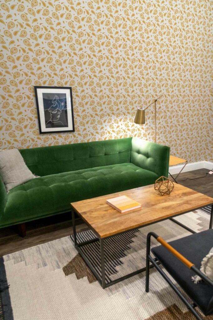 Mid-century modern living room decorated with Yellow paisley peel and stick wallpaper and forest green sofa