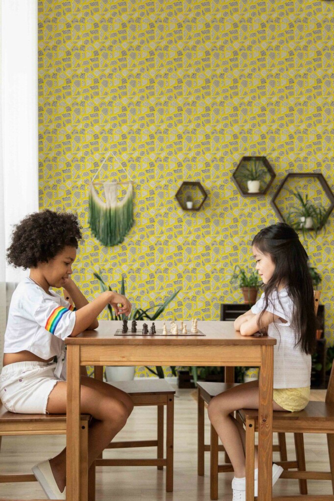 Boho style game room decorated with Yellow terrazzo peel and stick wallpaper